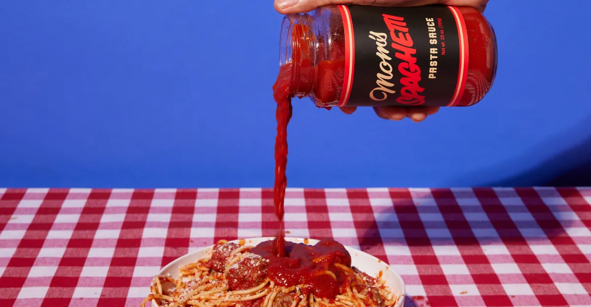 Red sauce poured onto pasta